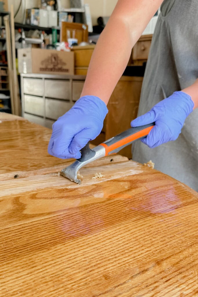 Scraping wood top with carbide scraper