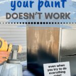 Using a paint sprayer to spray black primer on wood furniture