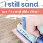 A hand using an electric sander on wood