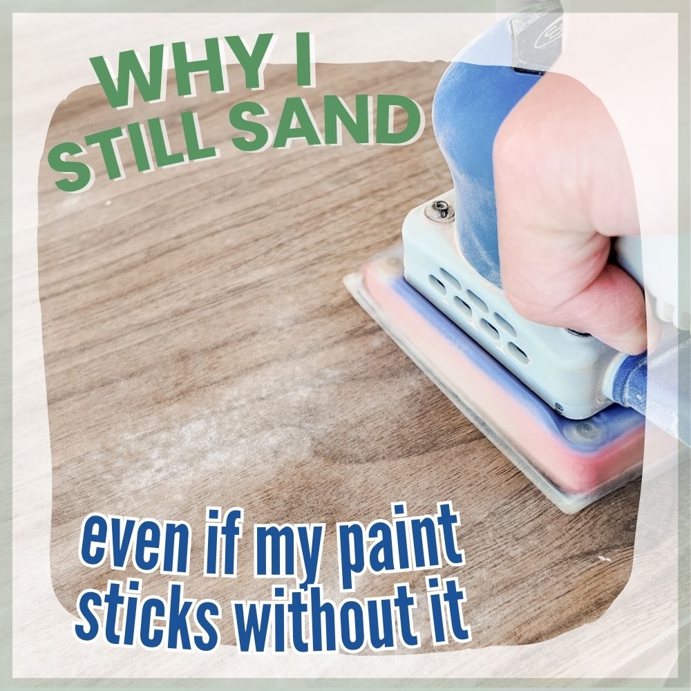 A hand holding a sander smooths wood