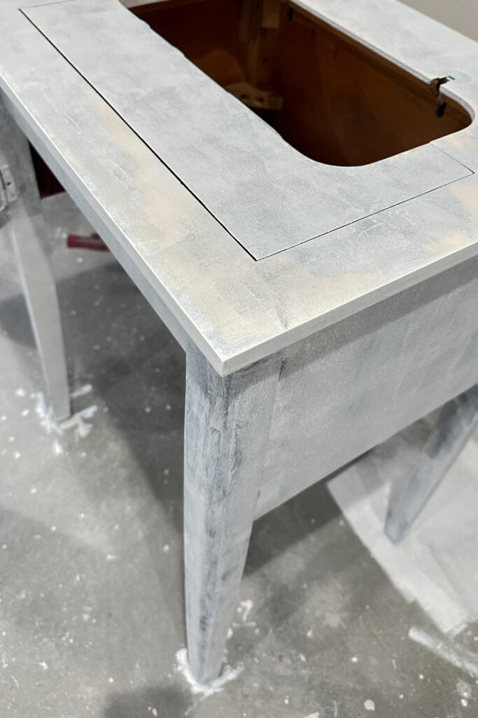 Painted wood table with yellow stains