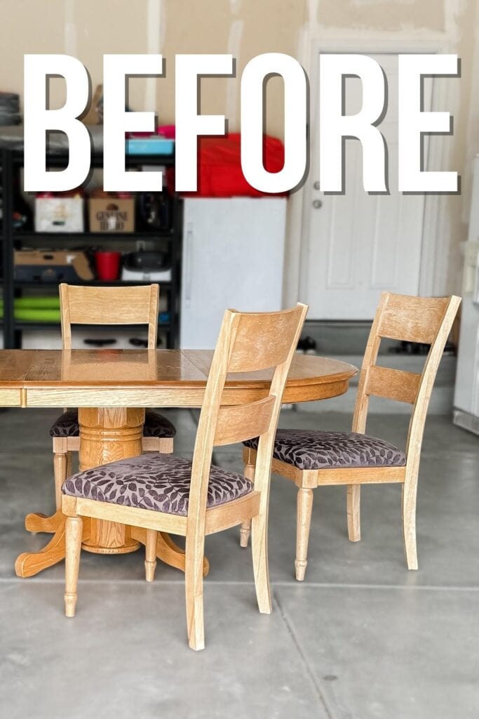 A wooden dining table with three chairs in a garage