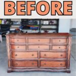 Dresser in a garage with BEFORE in large letters above it.