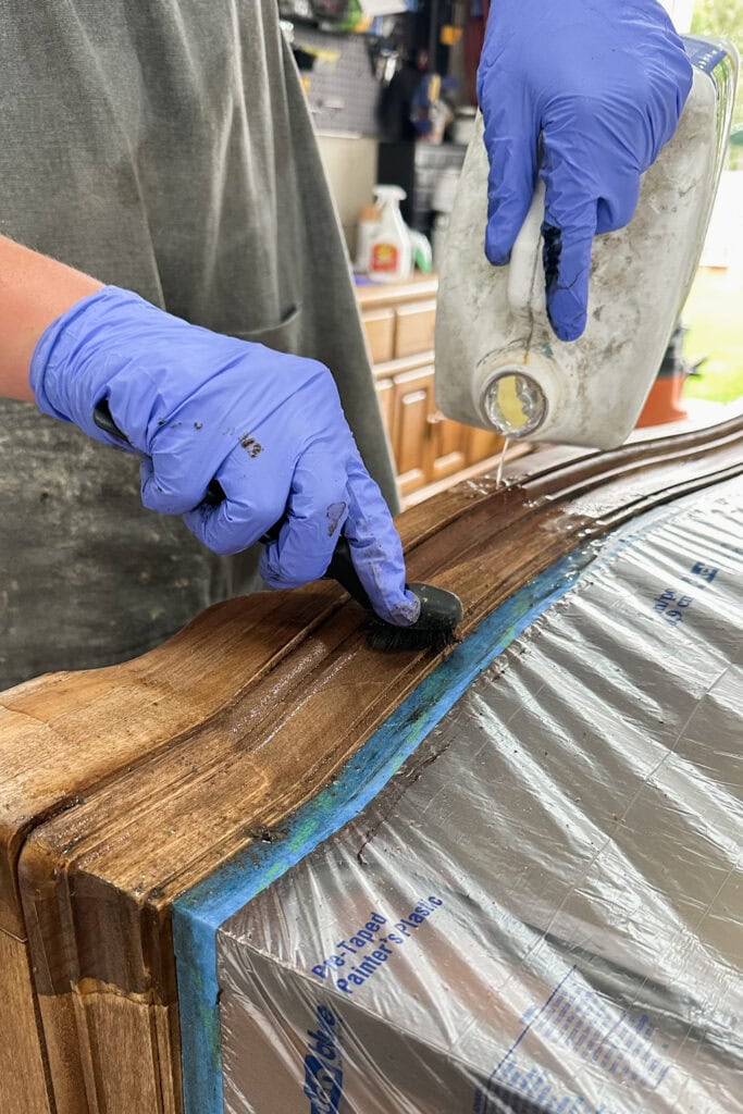 Cleaning dresser base with a wire brush and mineral spirits