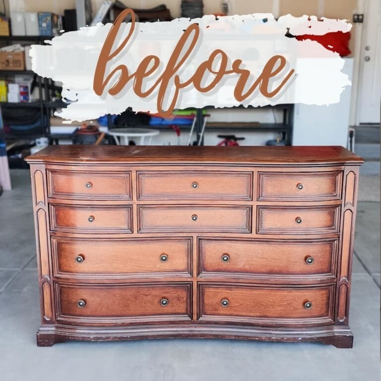 A vintage wooden dresser in a garage