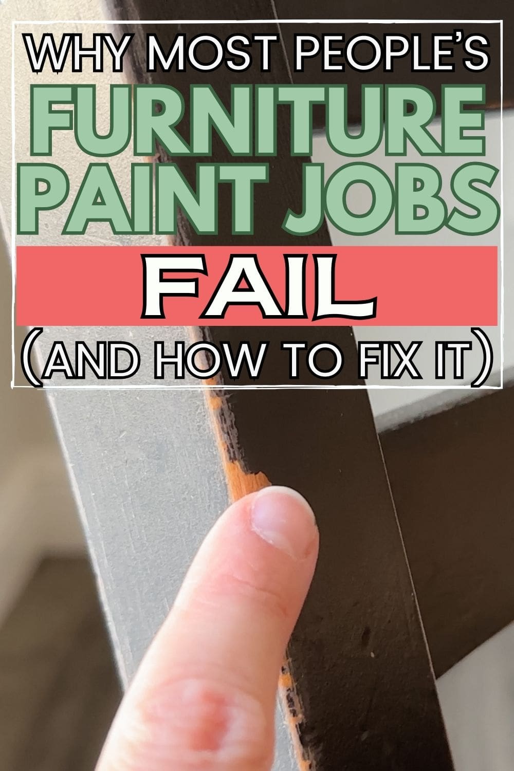 A finger on chipped paint on furniture