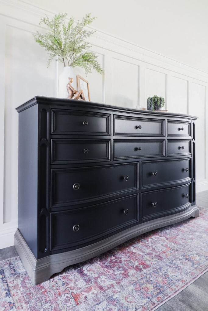 Side view of black dresser with multiple drawers