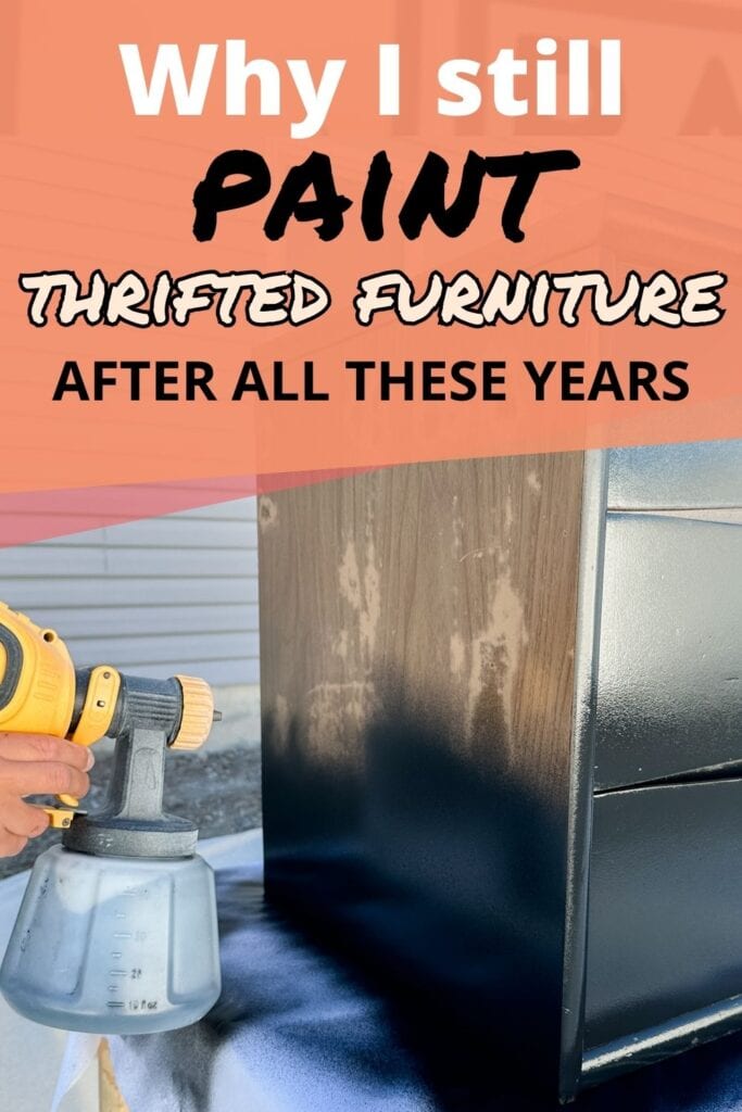 A person spray painting a wooden dresser