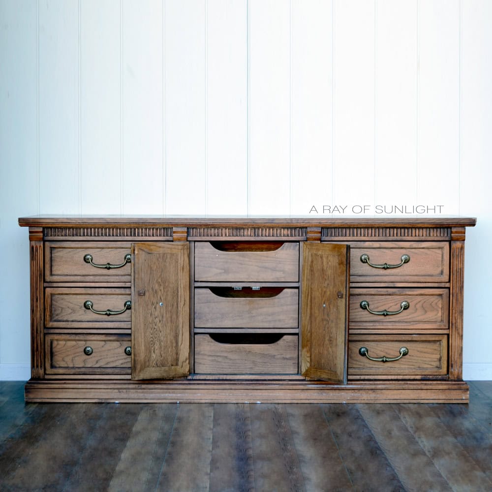 A wooden dresser with nine drawers