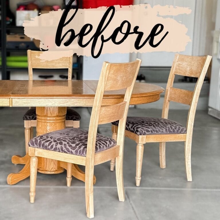 Round wooden dining table with three matching chairs