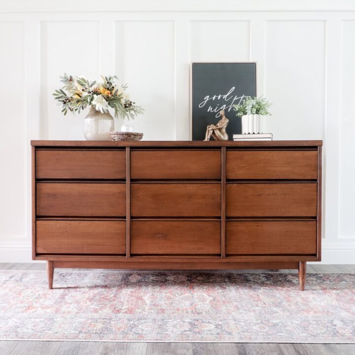 wood dresser with 9 drawers and decor on top