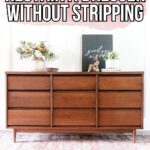 A mid-century modern dresser with a rich brown finish, decor on top, and text overlay about restaining.
