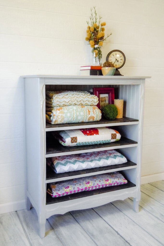 Side view of light grey dresser with shelves