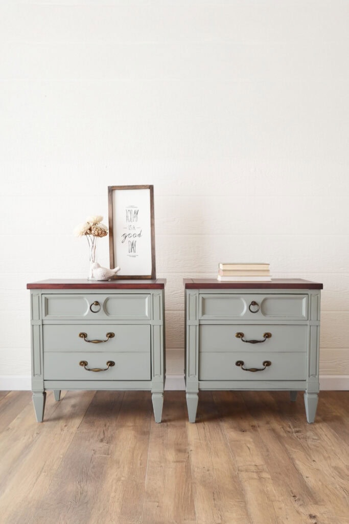 Full view of two light green nightstands with three drawers