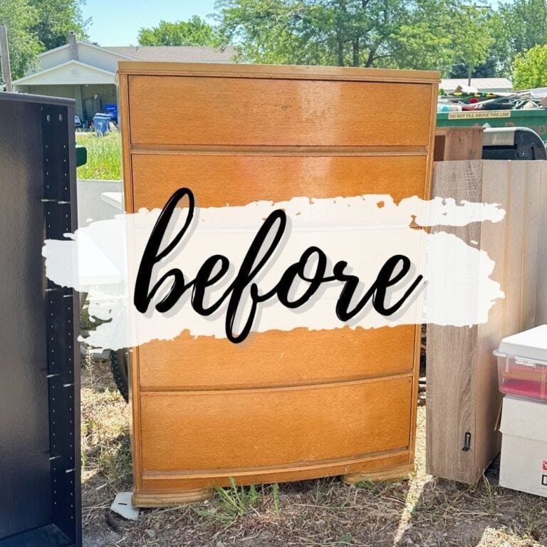 A wooden dresser outdoors with before written across it in bold script.