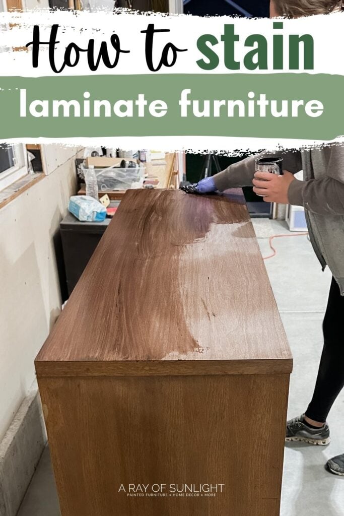 Person applying stain with gloved hand in a workshop