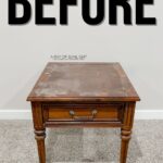 A worn wooden side table with one drawer, labeled BEFORE above it