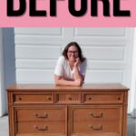 Natalie leans on a brown wooden dresser outside with BEFORE in large letters above