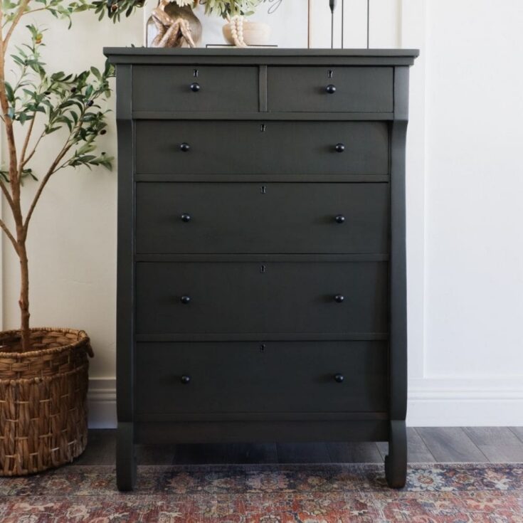 Dark tall wooden dresser with six drawers