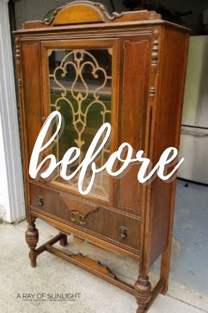 Vintage wooden china cabinet with glass doors labeled before in large script text across the front.