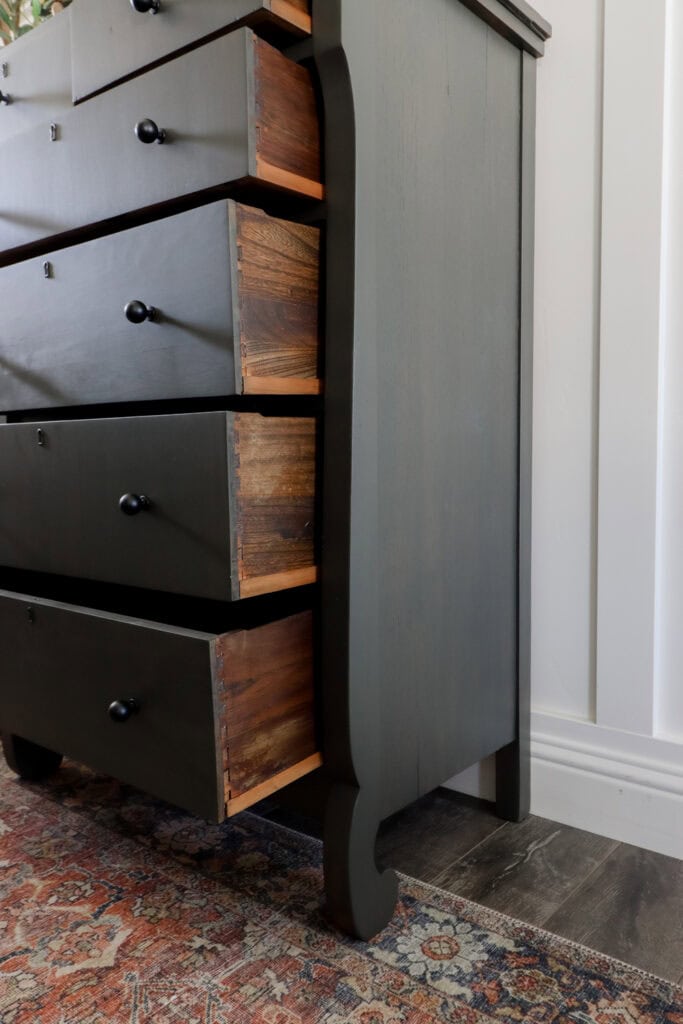 Closeup of dresser with several drawers partially open