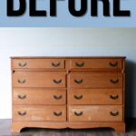 Old wooden dresser with worn finish and eight drawers, sitting on a wooden floor. BEFORE text above.