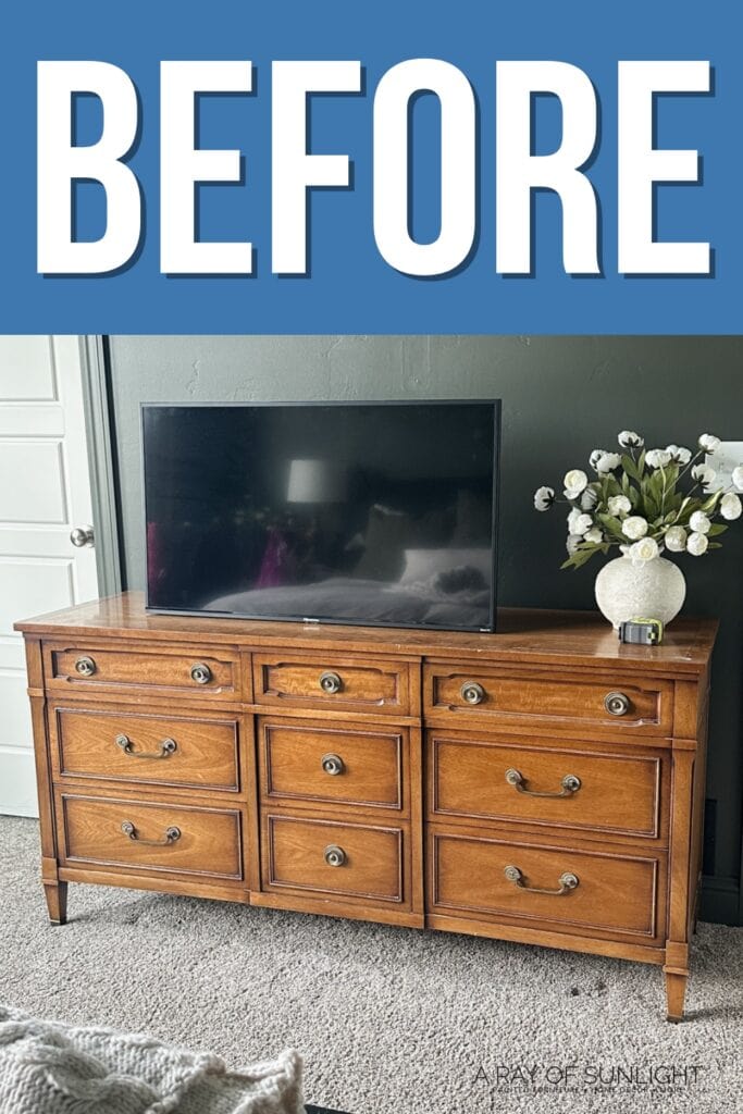 Wooden dresser with a TV and vase of flowers on top, and BEFORE text above in large white letters on blue.